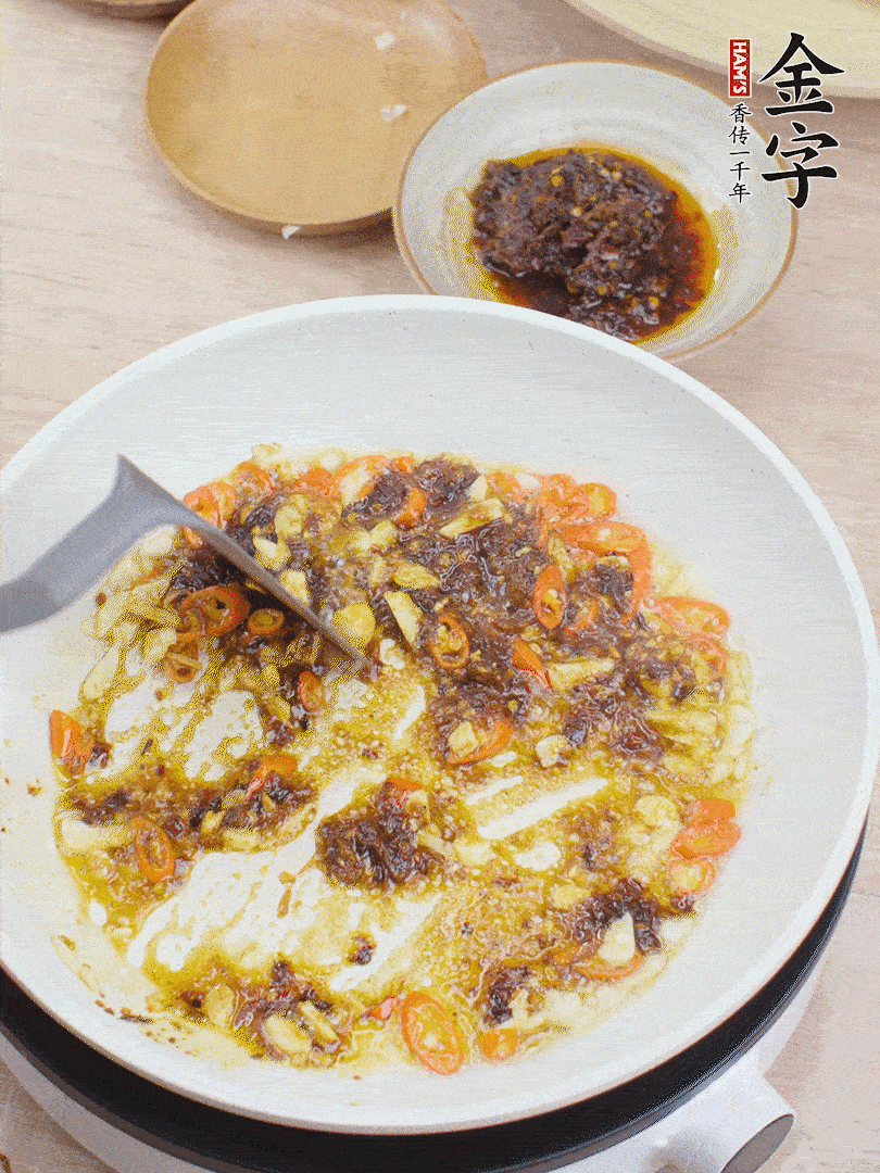 39152.com干贝酱1勺翻炒均匀。